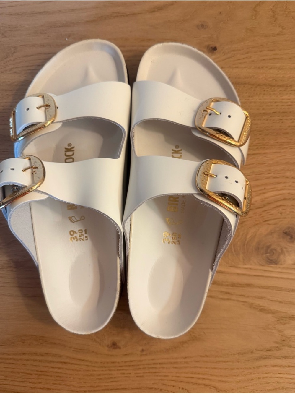 Birkenstock White Arizona Hammered Sandals with Gold Buckles